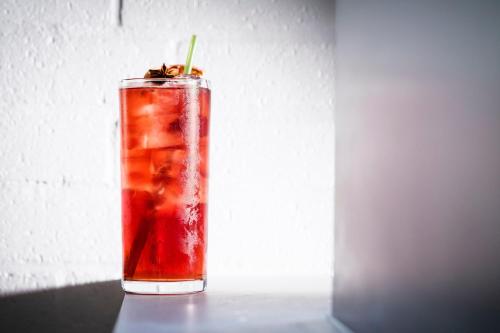 a drink is sitting on a table in a glass at Kimpton Hotel Fontenot by IHG in New Orleans