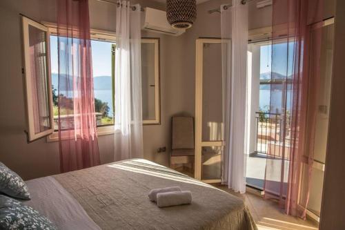 Кровать или кровати в номере Villa Odysseus