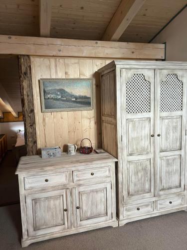 a large wooden cabinet next to a wall at Vila Liberta in Poprad