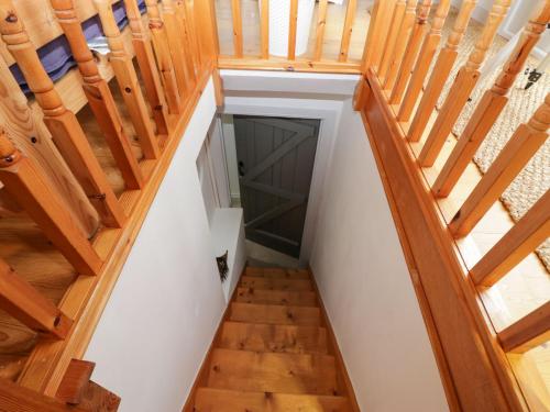 an overhead view of a stairway with wooden stairs at Station View in Soutergate