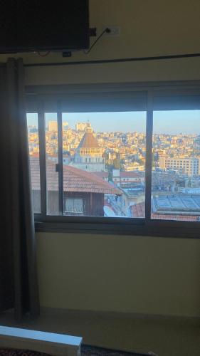 a view of a city from a window at Seedi Yousef Hostel & Cafe in Nazareth