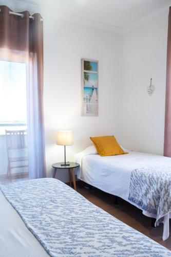 Giường trong phòng chung tại PKSC Surf House