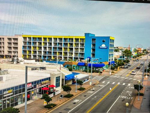 a view of a city street with a blue and yellow building at Days Inn by Wyndham Virginia Beach At The Beach in Virginia Beach