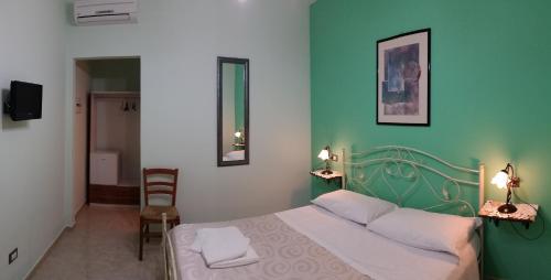 En eller flere senge i et værelse på La palma vacanze