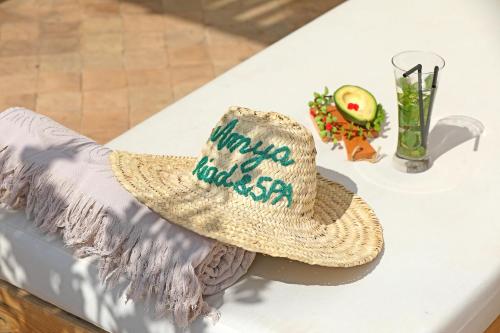 a straw hat sitting on top of a table at Riad Amya & Spa in Marrakech