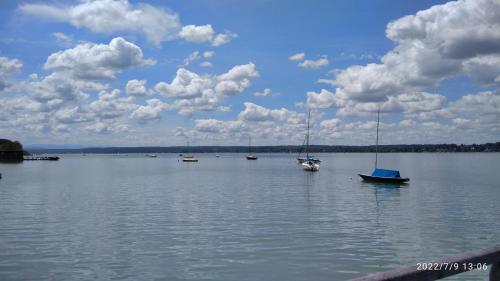a group of boats on a large body of water at komf.Ferienwohnung Elisabeth (1.Stock) in Weilheim, m.Garten, zwischen München u. Garmisch-P. in Weilheim in Oberbayern