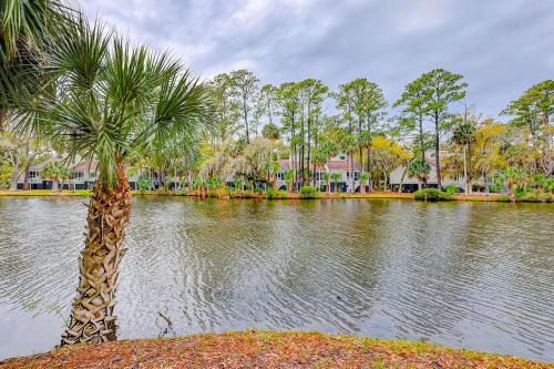 a palm tree in front of a body of water at Egrets Pointe, Unit 492 in Edisto Island