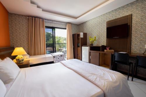 Ένα ή περισσότερα κρεβάτια σε δωμάτιο στο Hotel Green Hill