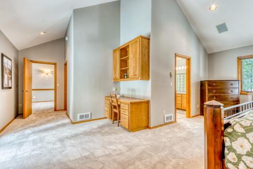 a large bedroom with a bed and a dresser at Black Butte Gem in Black Butte Ranch