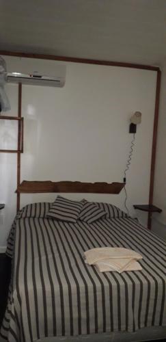 Кровать или кровати в номере Av. Central 545