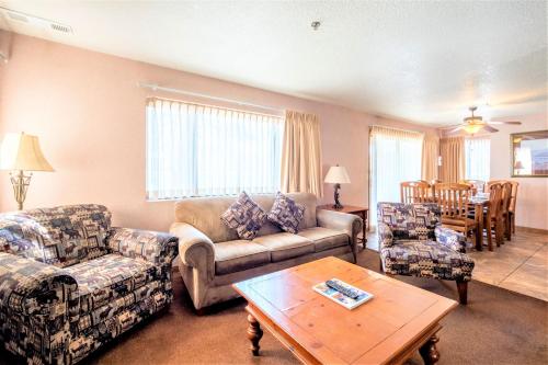 a living room with a couch and chairs and a table at Lagonita Lodge in Big Bear Lake