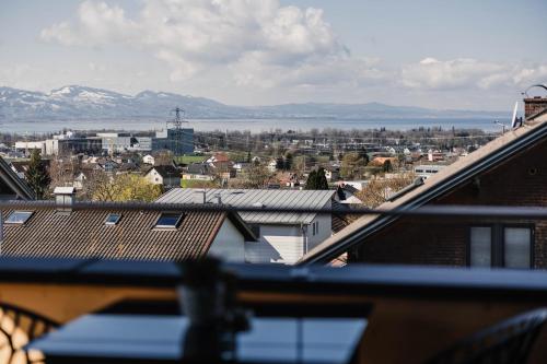 a view of a city from a balcony with mountains at Ferienhaus Sandra in Hörbranz