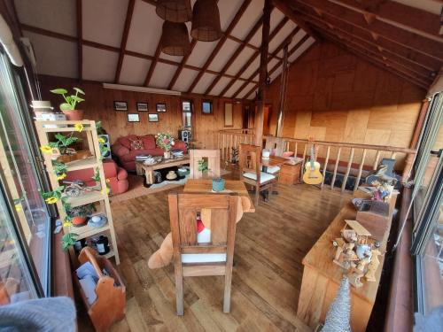 an overhead view of a living room with a table at Hostel Torobayo in Valdivia