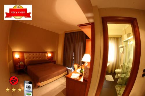 Letto o letti in una camera di Hotel Luxor