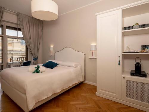 a bedroom with a bed with a teddy bear on it at Attico 195 in Salerno