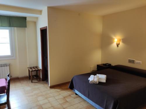 Cama o camas de una habitación en Hotel Nuevo Cachalote
