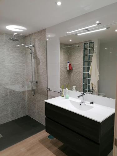 a bathroom with a sink and a shower at Las Vistas in Buendía