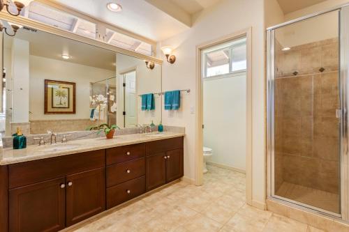 a bathroom with a double sink and a shower at Mauna Lani Fairways 401 in Waikoloa