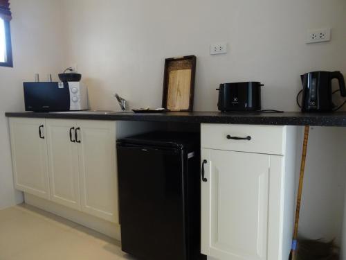 Η κουζίνα ή μικρή κουζίνα στο Koh Phangan Pavilions Serviced Apartments