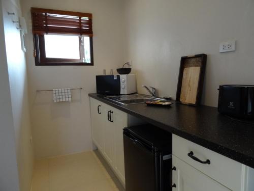 Η κουζίνα ή μικρή κουζίνα στο Koh Phangan Pavilions Serviced Apartments