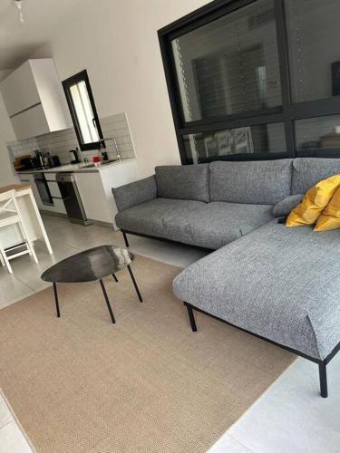 a living room with a couch and a table at Utopia apartment *top location* in Tel Aviv