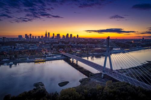 a bridge over a river with a city in the background at Holiday Inn Express - Warsaw - The HUB by IHG in Warsaw