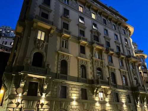 a building with lights on the side of it at bocca di lupo in Genova