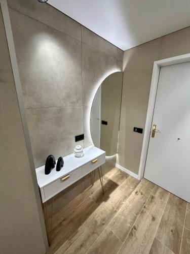 a room with a white table and a mirror at Apartamento Salou Playa Jaime I in Salou