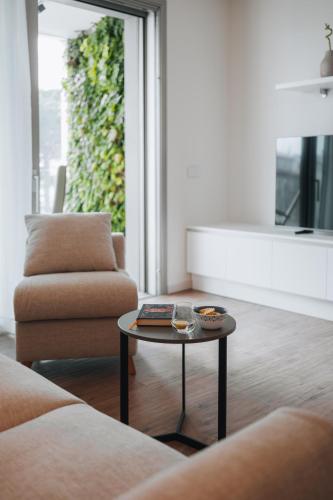 a living room with a coffee table and a couch at Sea Breeze in Caorle