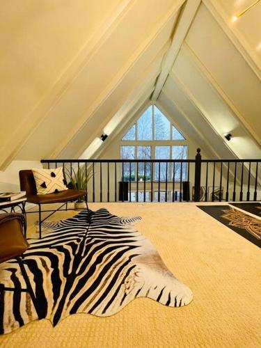 a zebra rug on the floor of a room at A Cozy Retreat in Gainesville