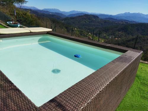 a swimming pool with a view of the mountains at AMPHIORAMA in La Spezia