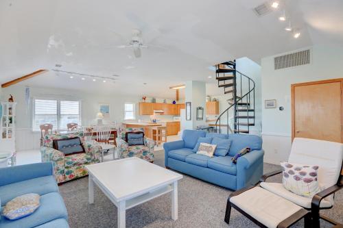 a living room with a blue couch and a table at Gray Haven #11-DE in Avon