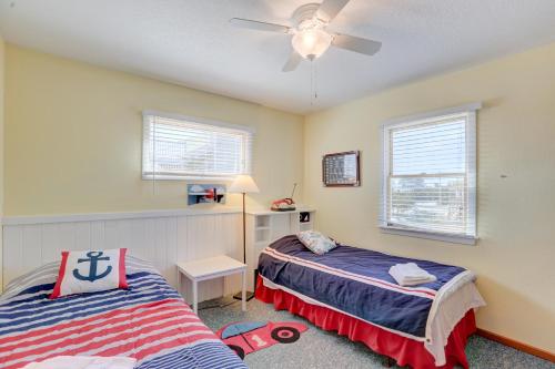 a bedroom with two beds and a ceiling fan at Gray Haven #11-DE in Avon