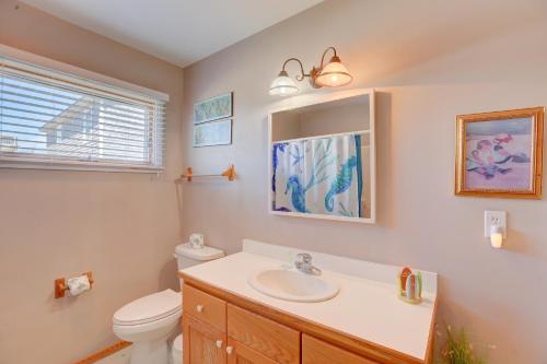 a bathroom with a sink and a toilet and a mirror at Gray Haven #11-DE in Avon