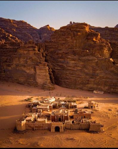 a village in the middle of a desert at غرووب وادي رم in Wadi Rum