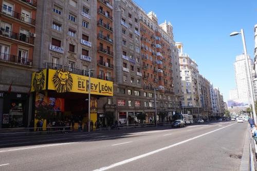 an empty city street with tall buildings at Mucho Madrid in Madrid