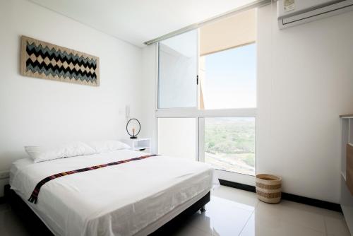 Cama ou camas em um quarto em Santa Marta Moderno Loft: vistas al mar y montaña