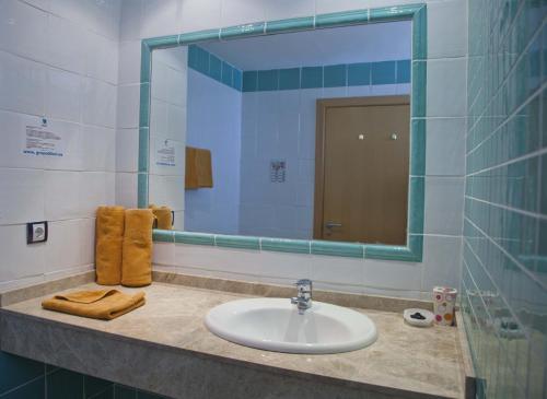a bathroom with a sink and a mirror at Terraza de Amadores in Puerto Rico de Gran Canaria