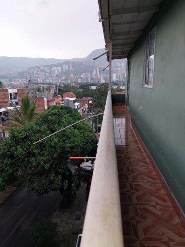 a balcony of a building with a view of a city at Los balcones lll in Medellín