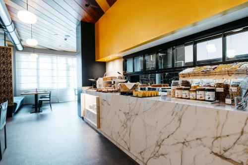a kitchen with a counter with food on it at Best Western Hotel Tre Torri in Altavilla Vicentina
