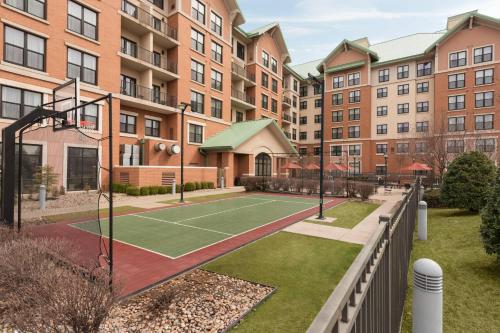 a tennis court in front of some buildings at Residence Inn by Marriott Oklahoma City Downtown/Bricktown in Oklahoma City