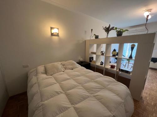 A bed or beds in a room at Acogedor mono en Palermo Chico. Excelente Ubicación!