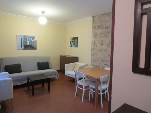 Un lugar para sentarse en Apartamentos Turísticos El Losal