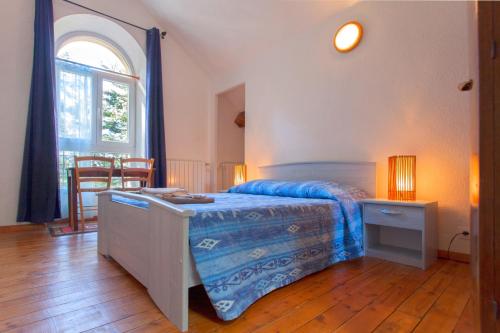 מיטה או מיטות בחדר ב-Casa Alta