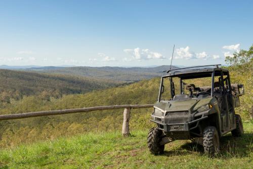 a military jeep parked on a hill in a field at Spicers Hidden Vale in Grandchester