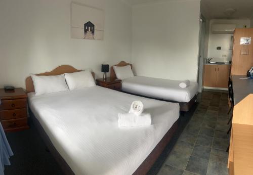 Кровать или кровати в номере Pete's Place Roma