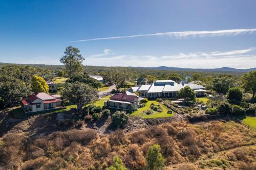 an aerial view of a house on a hill at Spicers Hidden Vale in Grandchester