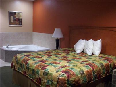 Ένα ή περισσότερα κρεβάτια σε δωμάτιο στο Budgetel Inn and Suites