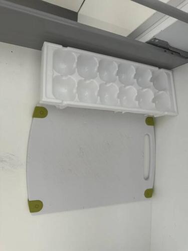 a shelf in a room with cups on it at Torre EME 414 Vista al Mar in Mazatlán
