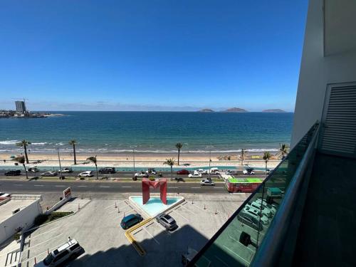 a view of a beach and the ocean from a building at Torre EME 414 Vista al Mar in Mazatlán